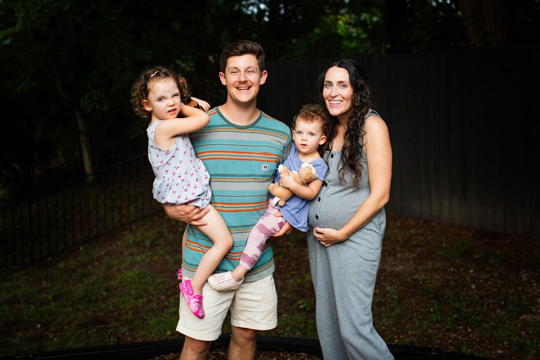 A man, woman and two children posing for a picture